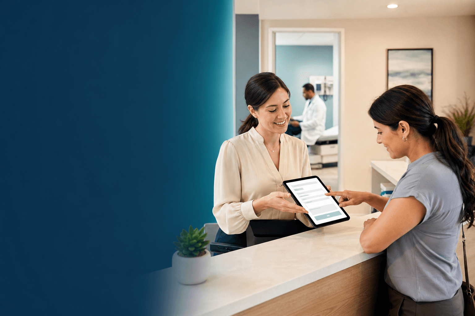 A medical office staff member helping a patient complete a digital form on a tablet in a doctor office